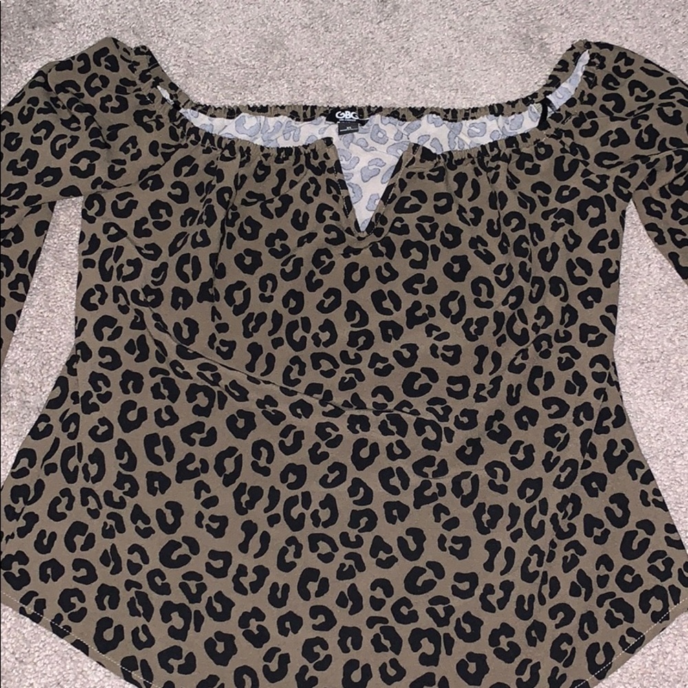 Over the shoulder animal print blouse
